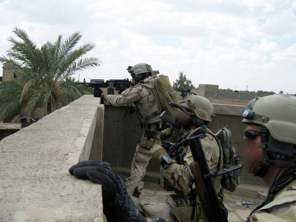 Navy SEALs on a roof overlook in Ramadi in 2006. (Faces have been blurred to protect identities.) Photo: Courtesy Jocko Willink and Leif Babin