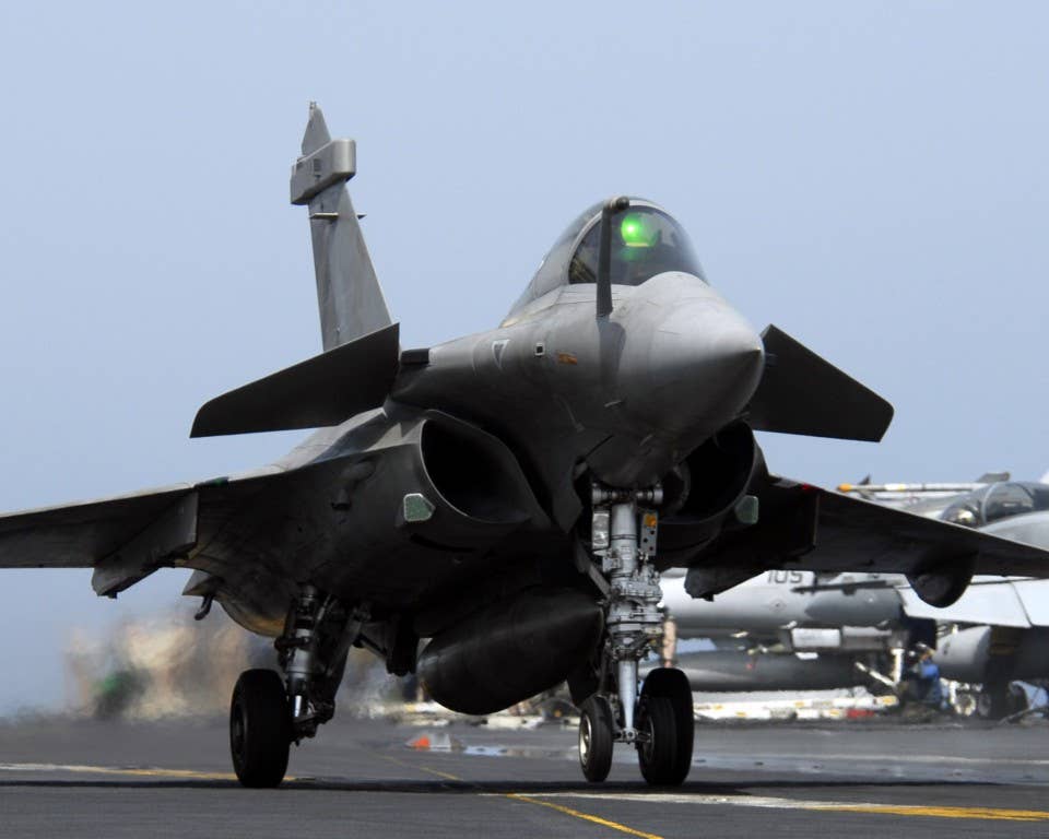 A French Dassault Rafale performs a touch-and-go landing. Photo: US Navy Mass Communication Specialist 1st Class Denny Cantrell