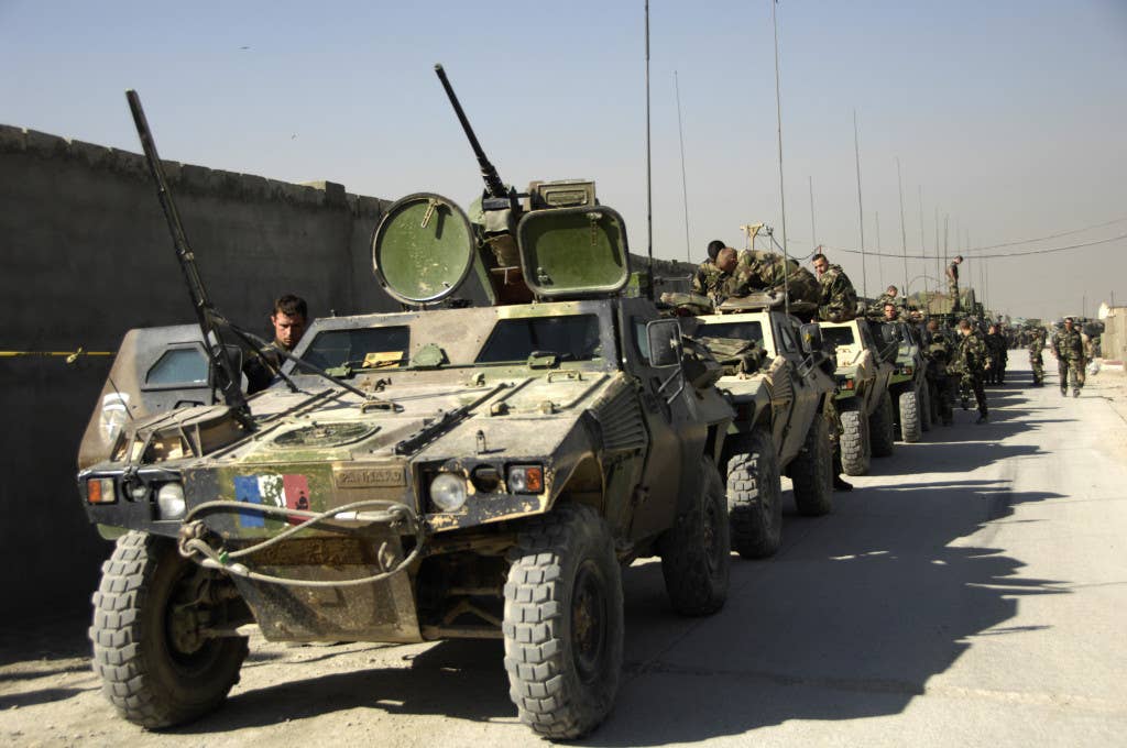 SAROBI, Afghanistan - French army soldiers prepare their vehicles for a convoy prior to departing camp for the International Security Assistance Force (ISAF) mission, Operation Eagle. (ISAF photo by MC1 Michael E. Wagoner)