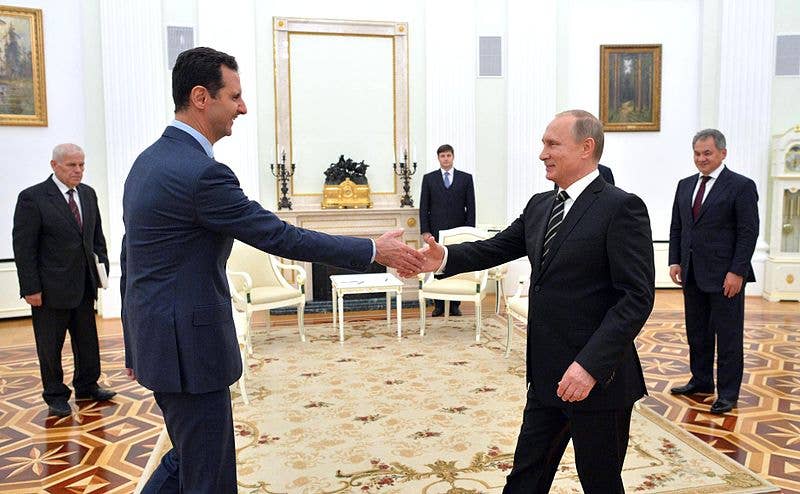 The last one to touch Putin wins . . . (Kremlin Photo)