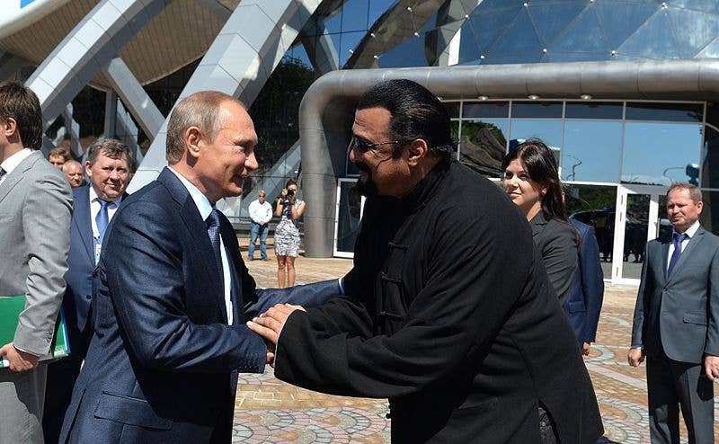 They aren't shaking hands, they're both trying to break the other's arm. (Kremlin photo)