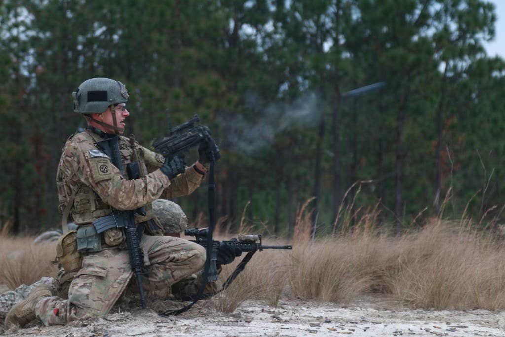 A soldier fires the M320 grenade launcher. The M320 can be slung under an M4 or M16 or carried as a standalone weapon. Photo: US Army Staff Sgt. Christopher Freeman