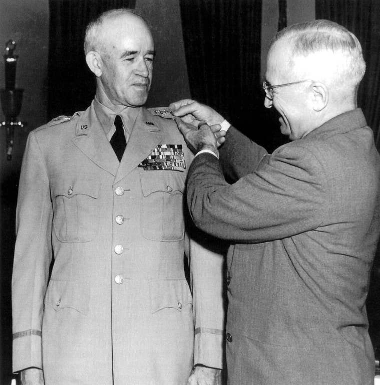Snap to it, Truman! The buck stops when I tell it to. (DoD Photo)
