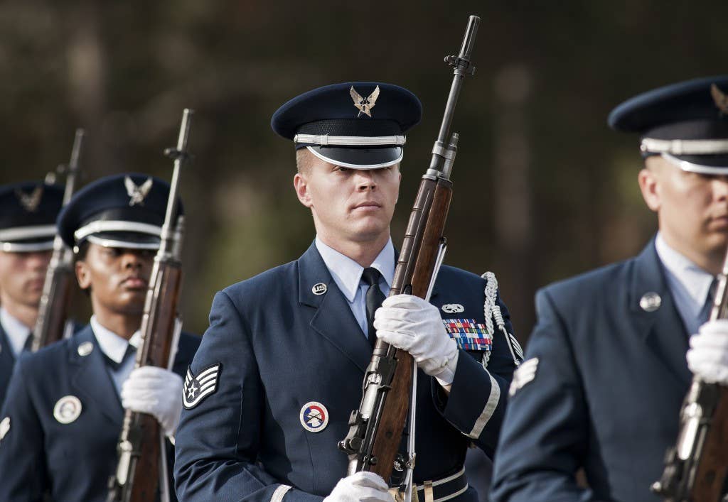 Staff Sgt. Sean Edmondson and other new honor guard members exit the field after the funeral ceremony at the honor guard graduation at Eglin Air Force Base, Fla. (U.S. Air Force photo/Samuel King Jr.)