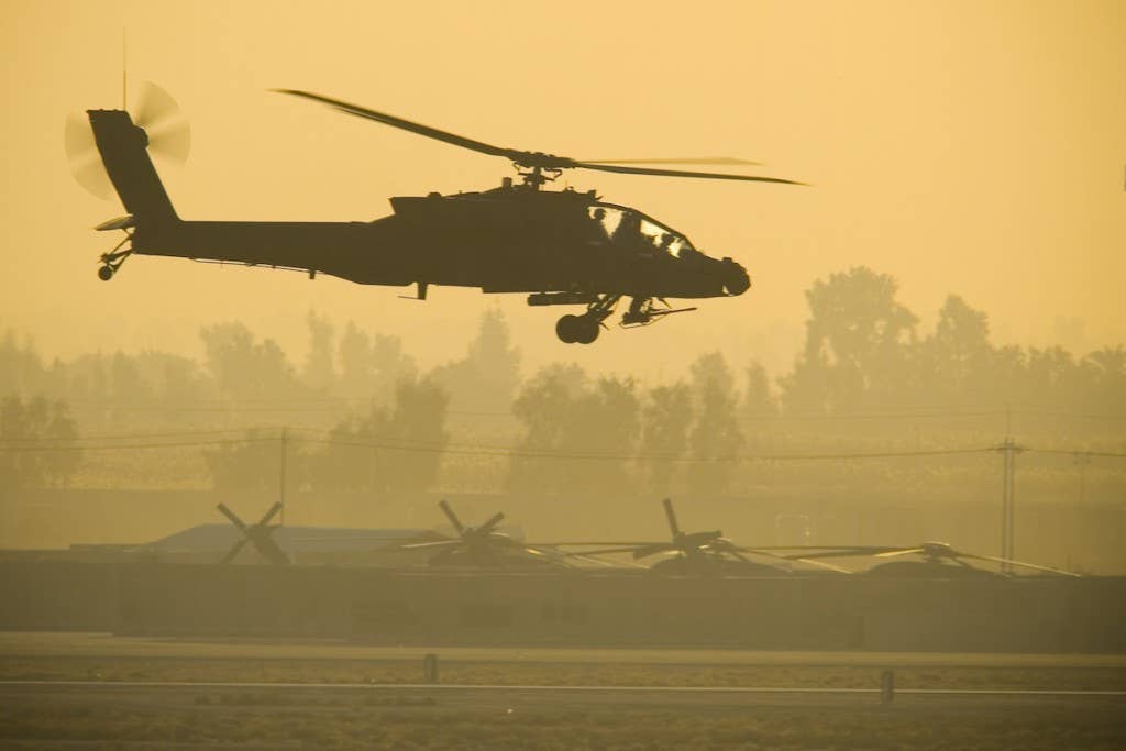 AH-64 Apache Attack Helicopter hovers before takeoff (Photo by U.S. Air Force Master Sgt. John Nimmo, Sr.)