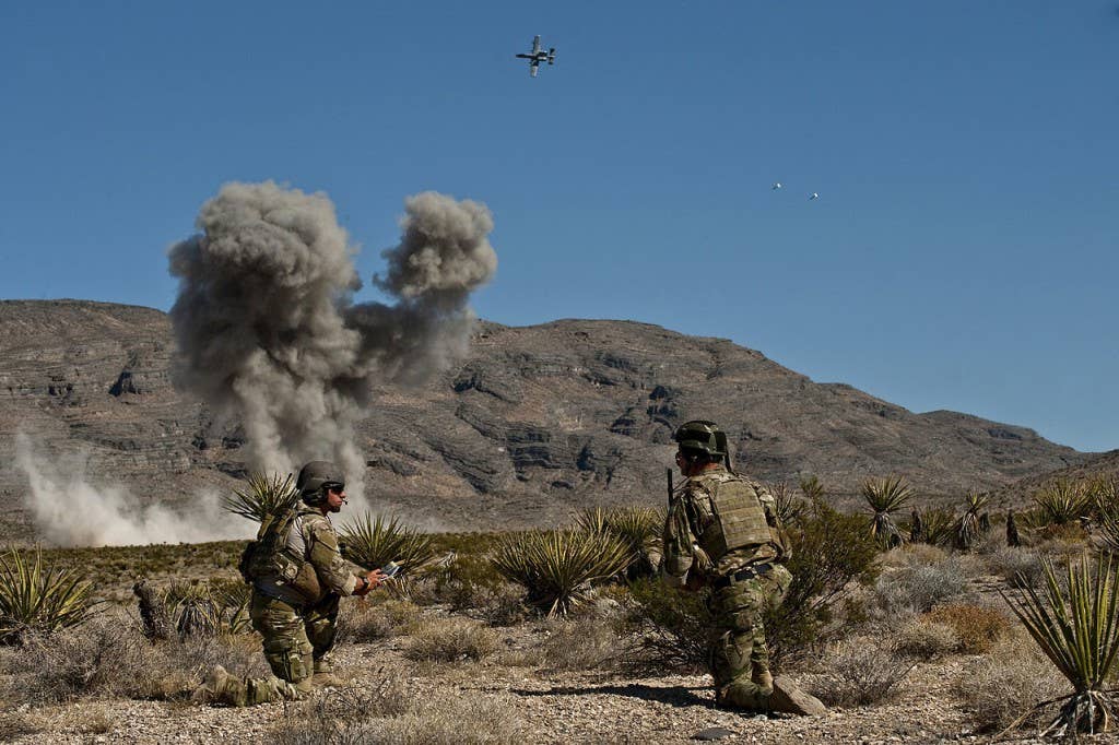 U.S. Air Force Combat Control JTACs from the 21st Special Tactics Squadron call for close air support from a A-10 Thunderbolt II while attending the Air Force's JTAC Advanced Instructor Course (U.S. Air Force photo by Tech. Sgt. Michael R. Holzworth)