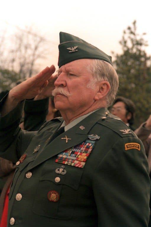 Medal of Honor recipient Col. Lewis Millett salutes the flag during a memorial ceremony commemorating the bravery of his men during the Korean War. (Photo: US Army Al Chang)