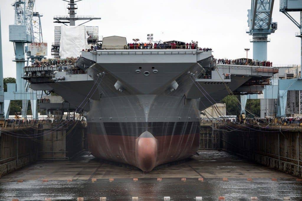 Newport News Shipbuilding floods Dry Dock 12 to float the first in class aircraft carrier, Pre-Commissioning Unit Gerald R. Ford | US Navy photo by Mass Communication Specialist 1st Class Joshua J. Wahl