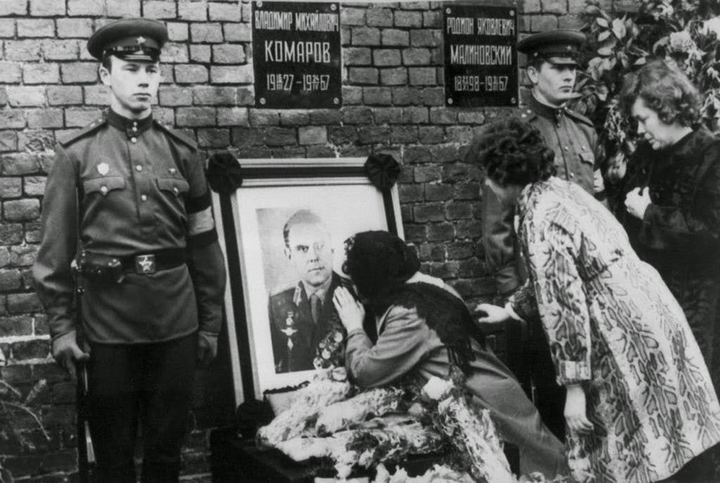 Valentina Komarov, the widow of Soviet cosmonaut Vladimir Komarov, kisses a photograph of her dead husband during his official funeral, held in Moscow's Red Square on April 26, 1967. (Soviet Photo)