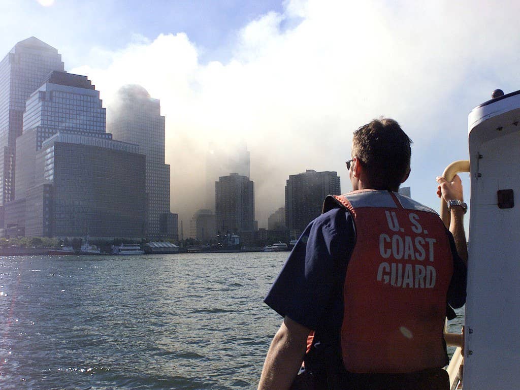 Coast Guard crewmembers patrol the harbor after the collapse of the World Trade Center. Terrorist hijacked four commercial jets and then crashed them into the World Trade Center in New York, the Pentagon and the Pennsylvania countryside. (USCG photo by PA3 Tom Sperduto)