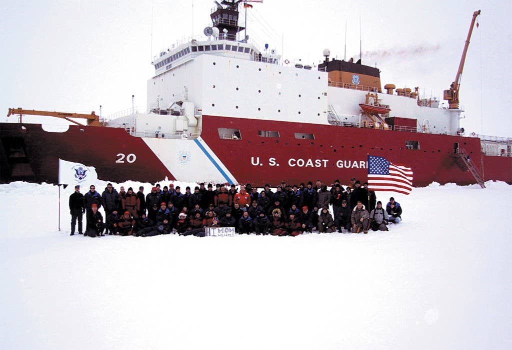 The Coast Guard Cutter Healy's crew poses in front of the cutter after reaching the North Pole Sept. 6. The Healy became only the second U.S. surface ship to reach the North Pole. (U.S. Coast Guard photo)