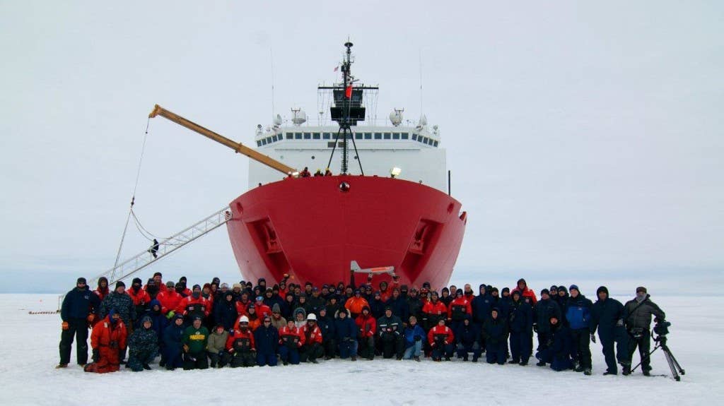 Ice liberty group photo, PUMA/RDC personnel and the Coast Guard Cutter Healy crew on the ice. (U.S. Coast Guard photo by Chief Petty Officer Shannon Riley)
