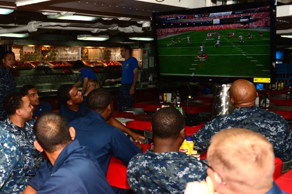 Sailors compete in a video game tournament aboard the aircraft carrier USS Ronald Reagan (CVN 76). (U.S. Navy photo by Mass Communication Specialist 3rd Class Torrian Neeman)