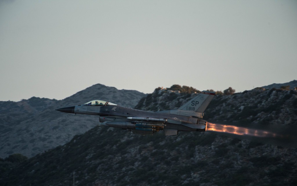 air force jet flies in the mountains