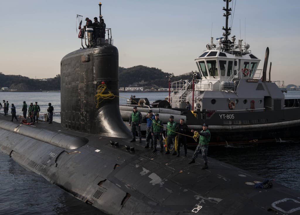 Sailors aboard the Virginia-class attack submarine USS Texas (SSN 775) moor the boat to the pier. (U.S. Navy photo by Mass Communication Specialist 2nd Class Brian G. Reynolds)