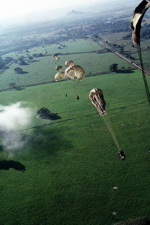 S Soldiers of 1st Battalion, 508th Infantry, parachute from a C-130E Hercules aircraft into a drop zone outside the city to conduct operations in support of Operation Just Cause. (U.S. Air Force photo by Master Sgt. Ken Hammond)