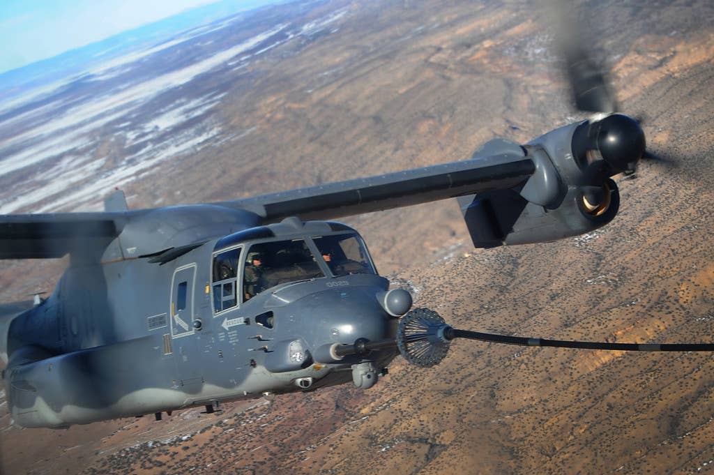 A 71st Special Operations Squadron CV-22 Osprey receives fuel from a 522 SOS, MC-130J Combat Shadow II aircraft, over the skies of New Mexico.