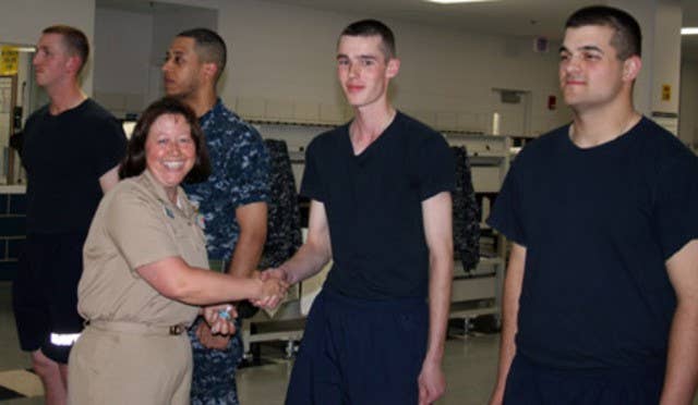 Nothing says hardcore discipline like a recruit smiling and shaking hands with the higher-ups during a photo op.