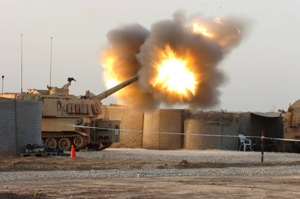 Artillery being fired from a tank