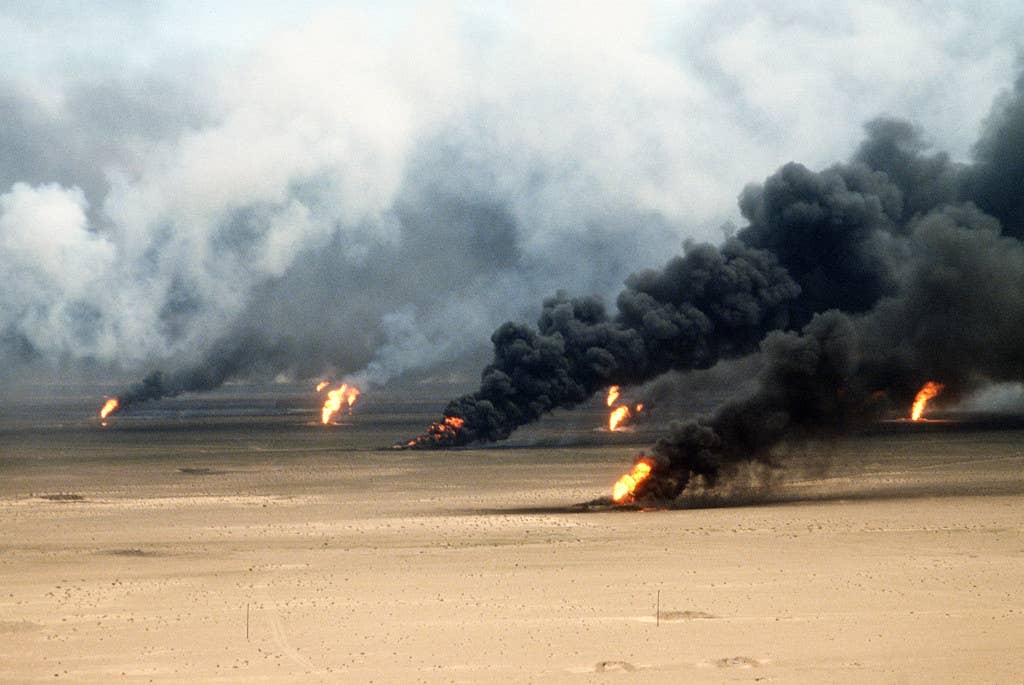 Oil well fires rage outside Kuwait City in the aftermath of Operation Desert Storm. The wells were set on fire by Iraqi forces before they were ousted from the region by coalition force. (U.S. Air Force photo by Tech. Sgt. David McLeod)