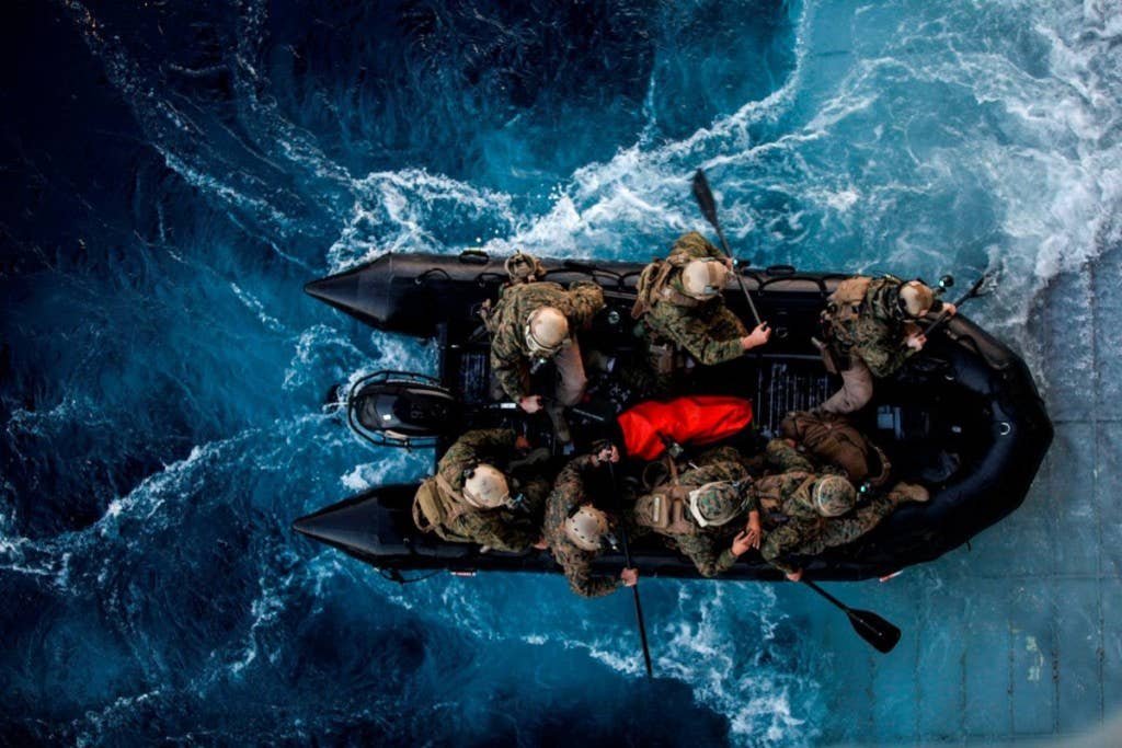 Marines with the 15th Marine Expeditionary Unit Maritime Raid Force depart the USS Essex (LHD 2) on a combat rubber raiding craft during Amphibious Squadron Three/Marine Expeditionary Unit Integration Training (PMINT) off the coast of San Diego March 4, 2015. | Photo by U.S. Marine Corps
