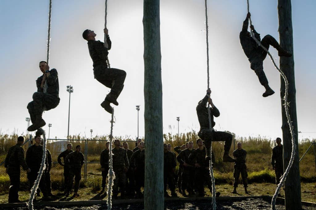 U.S. Marines with Special-Purpose Marine Air-Ground Task Force Crisis Response-Africa ascend ropes during an obstacle course on Rota Naval Base, Spain, Feb. 26, 2015. | Photo by Lance Cpl. Christopher Mendoza, U.S. Marine Corps