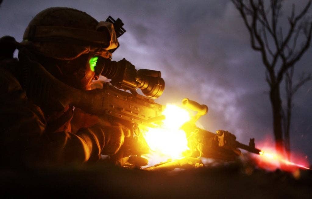 Pfc. Sebastian Rodriguez, machine gunner, Weapons Platoon, Lima Company, 3rd Battalion, 3rd Marine Regiment, Marine Rotational Force - Darwin, fires an M240 machine gun during a night squad-attack exercise, here, May 22. MRF-D Marines used machine gunners, snipers and rifleman to suppress a simulated squad-sized enemy attack. | Photo by Sgt. Sarah Fiocco/U.S. Marine Corps