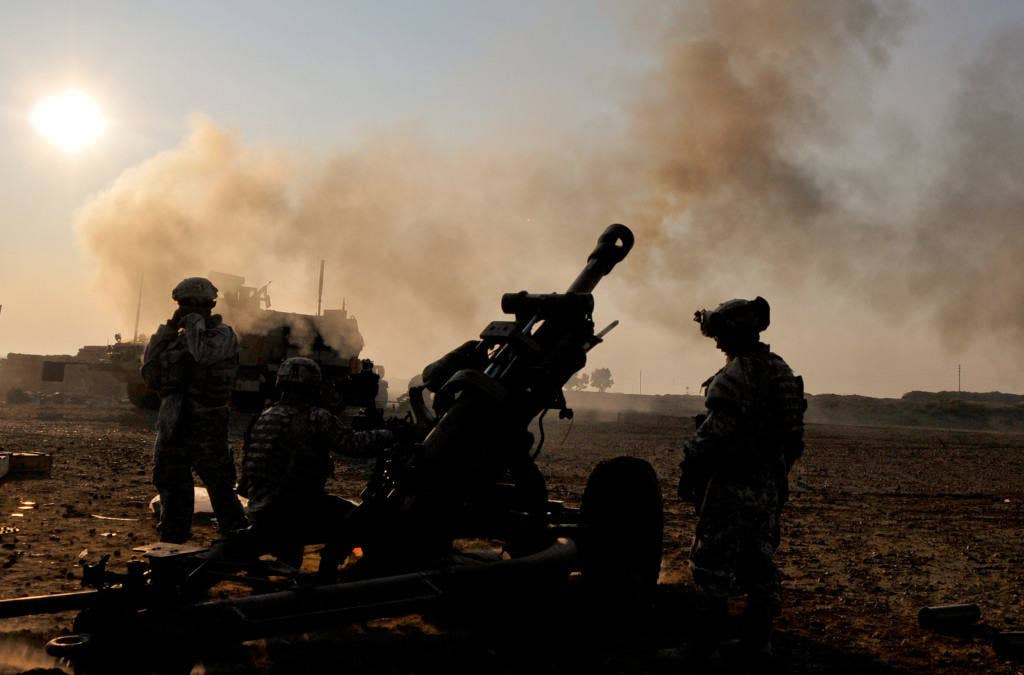 Soldiers from Alpha Battery, 2nd Battalion, 320th Field Artillery Regiment, 1st Brigade Combat Team, 101st Airborne Division (Air Assault), fire high-explosive artillery rounds from their M119A2 Howitzer during Operation Fulton Harvest near Samarrah, Iraq. (U.S. Army photo)