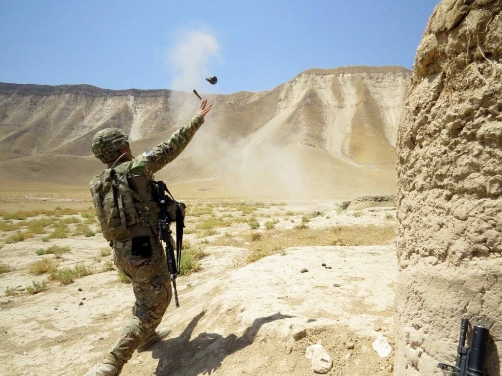 U.S. Army Lt. Charles Morgan, with the 6th Squadron, 4th Cavalry Regiment, 3rd Brigade Combat Team, 1st Infantry Division, throws a M67 fragmentation grenade during skills training at Kunduz province, Afghanistan, July 3, 2013. (U.S. Army photo by Sgt. Avila /Released)