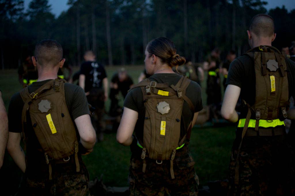 U.S. Marines from Delta Company, Infantry Training Battalion (ITB), School of Infantry-East (SOI-E) take a break after completing their 10k hike before navigating their way through the obstacle course aboard Camp Geiger, N.C. (U.S. Marine Corps photo)