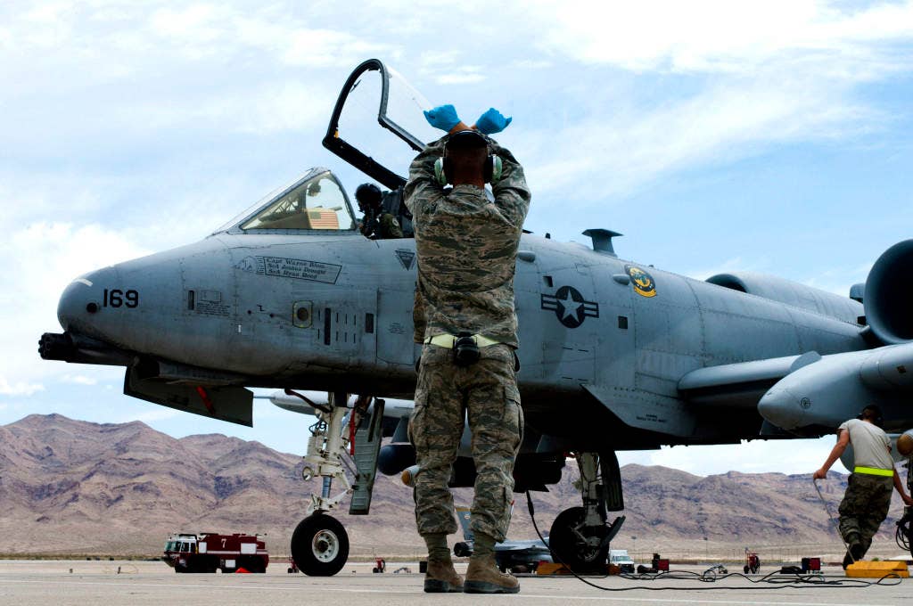 Airman Brandon Kempf, 757th Aircraft Maintenance Squadron assistant dedicated A-10 Thunderbolt II crew chief, watches as an aircraft taxis into position after landing May 9, 2013, at Nellis Air Force Base, Nev. (U.S. Air Force photo by Airman 1st Class Joshua Kleinholz)