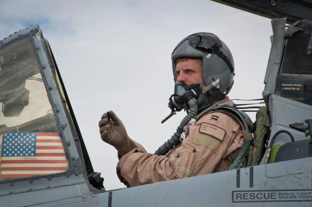 Capt. Richard Olson, 74th Expeditionary Fighter Squadron A-10 pilot, prepares to take flight at Kandahar Airfield, Afghanistan, Sept. 2, 2011. A-10s can survive direct hits from armor-piecing and high explosive projectiles up to 23mm. (U.S. Air Force photo)
