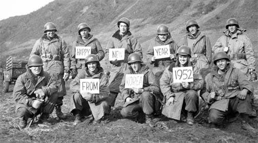 Dressed in parkas (Overcoat, parka type, with pile liner), Missouri infantrymen pose for a New Year greeting, 19th Infantry Regiment, Kumsong front, Korea, 14 December 1951. (Photo: U.S. Army)