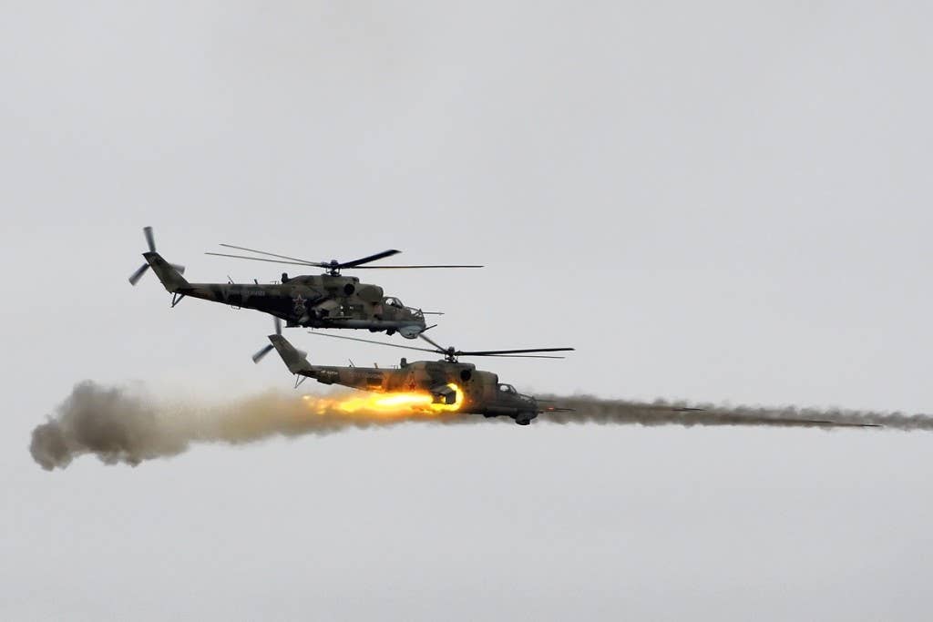 Russian Hind helicopters launch rockets. Photo: Alex Beltyukov CC BY-SA 3.0