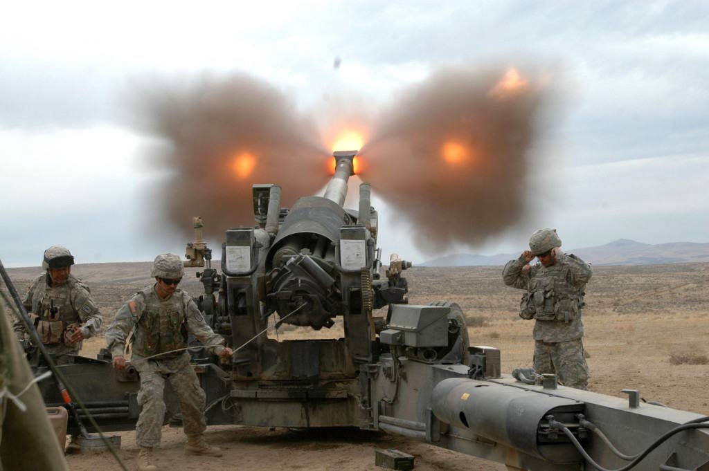 Soldiers with Charlie Battery, 1-377 FA fire an M198, 155mm howitzer during a recent combined live-fire exercise. | U.S. Army photo