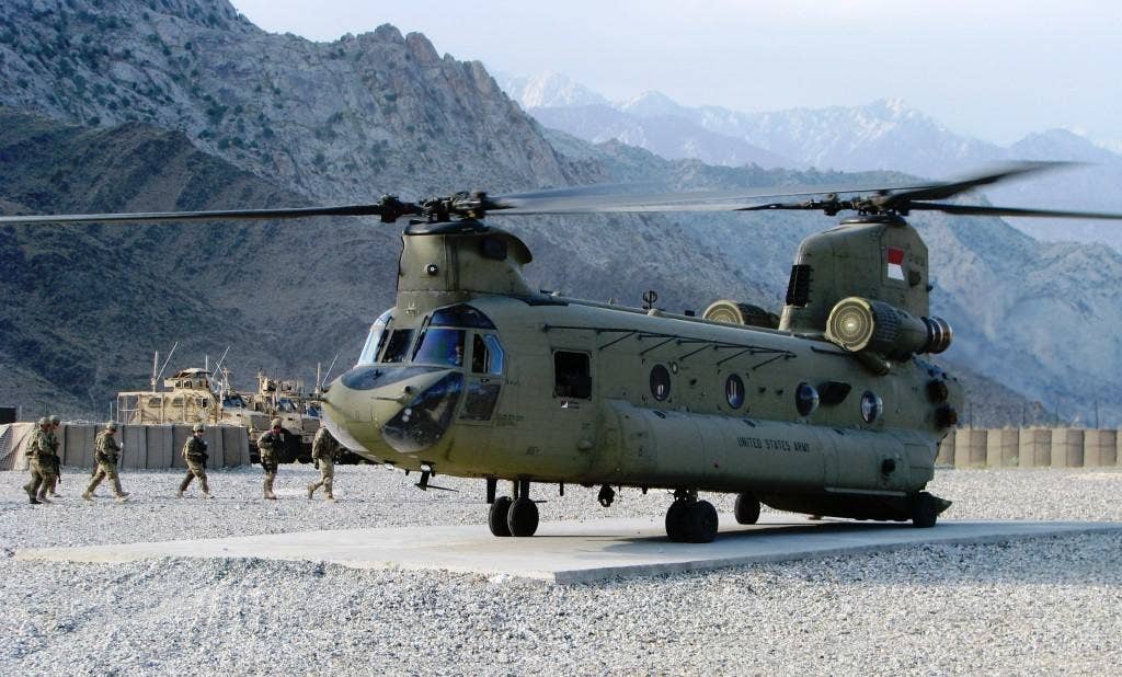A Chinook loads passengers at Forward Operating Base Kala Gush's flight line. Photo: US Army Maj. Christopher Thomas