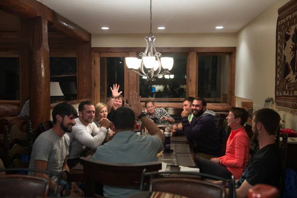 Military veterans share their individual stories during dinner at an adaptive sports camp in Crested Butte, Colo.