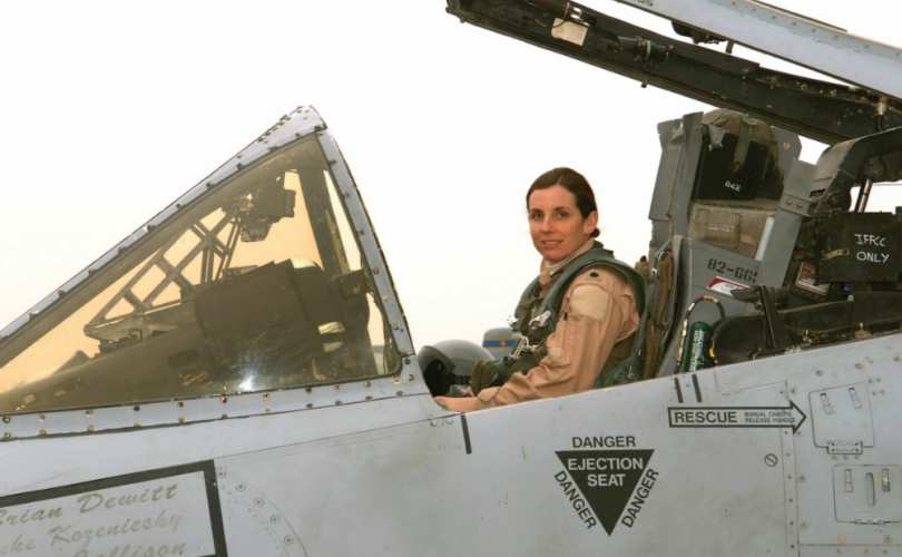 Representative Martha McSally, pictured in her office during her Air Force career, preparing to distribute BRRRRRT. Helps explain why the A-10 will be around indefinitely. (Photo credit unknown)