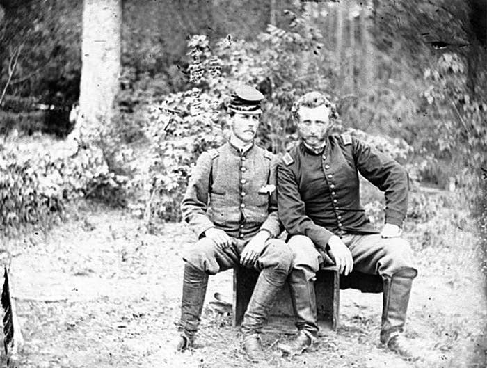 Custer (right) with rebel prisoner.