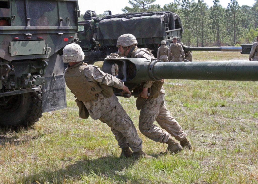 Marines hitch an M-777 up to a truck. | U.S. Marine Corps photo