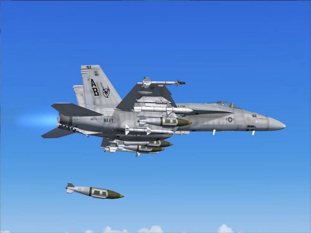 An F/A-18C (also loaded with Sidewinder and AMRAAM air-to-air missiles and HARM anti radar missiles) dropping a 1,000-pound bomb. (Photo: U.S. Navy)