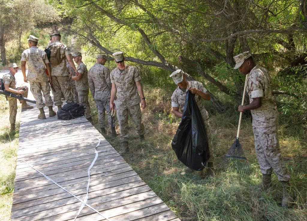 Marines with Marine Corps Air Station Miramar and the 3rd Marine Aircraft Wing pick up trash during a station-wide cleanup aboard MCAS Miramar, California, April 20. They also conducted a cleanup alongside major roadways bordering the air station.