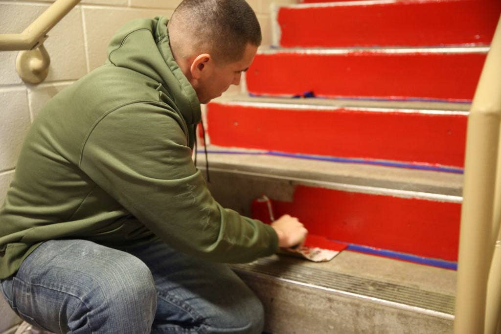 1st&nbsp;Lt. Edwin Roman paints steps in barracks 4295 at Marine Corps Air Station Cherry Point, N.C., Nov. 25, 2014. Staff noncommissioned officers and officers of Marine Air Control Group 28 cleaned and renovated the barracks in an effort to give back to the Marines during the holiday season. The Marines worked on various projects including, painting, landscaping and fixing furniture. Roman is a communications officer with Marine Air Support Squadron 1.