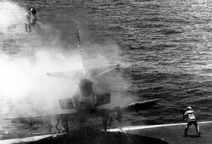 Lt. (j.g.) William Belden ejects from an A-4E Skyhawk on the deck of the USS Shangri-La in the western Pacific circa 29 July 1970.