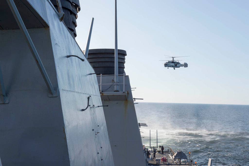 BALTIC SEA (April 12, 2016) A Russian Kamov KA-27 HELIX helicopter flies low-level passes near the Arleigh Burke-class guided missile destroyer USS Donald Cook (DDG 75) while the ship was operating in international waters April 12, 2016. Donald Cook is forward deployed to Rota, Spain, and is conducting routine patrols in the U.S. 6th Fleet area of operations in support of U.S. national security interests in Europe. (U.S. Navy photo)