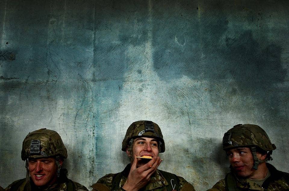 U.S. Air Force Combat Control trainees assigned to Operating Location C, 342nd Training Squadron, laugh with each other while sharing a meal ready to eat during a long day of training Feb. 13, 2015. Working as a team and keeping morale high within the unit is vital to each Airman's success as they push through training. At the 342nd TRS both CCT and Special Operations Weather Team trainees go through four months of grueling tactical and class room training. (U.S. Air Force Photo by Staff Sgt. Kenny Holston)