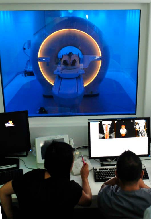 Magnetic Resonance Imaging (MRI) technologists scan a fake patient during the grand opening of the new MRI center at Naval Medical Center San Diego. (U.S. Navy photo by Mass Communication Specialist 2nd Class Sean P. Lenahan/Released)