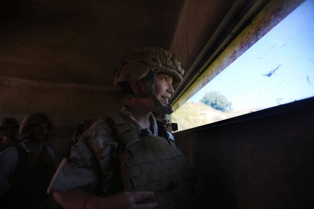 Nathan Aldaco, a 12 year-old boy with hypoplastic left heart syndrome, looks out of a bunker during a Make-A-Wish event supported by 7th Engineer Support Battalion, 1st Marine Logistics Group, aboard Camp Pendleton, Calif. (U.S. Marine Corps photo by Sgt. Laura Gauna)