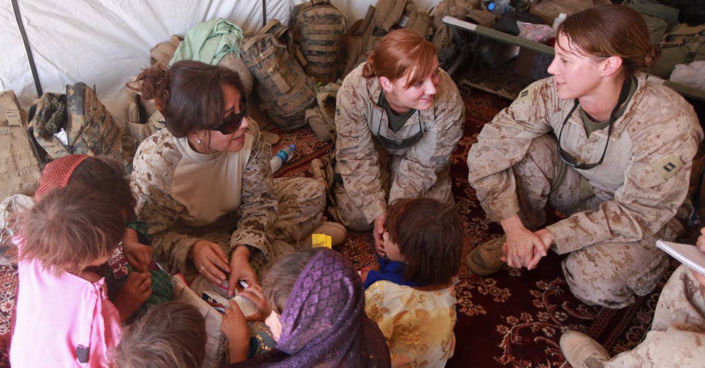 Marines and sailors from the female engagement team with Bravo Battery, 3rd Low Altitude Air Defense Battalion, conduct a medical outreach for residents in the village of Habib Abad, Afghanistan. (Photo: USMC)