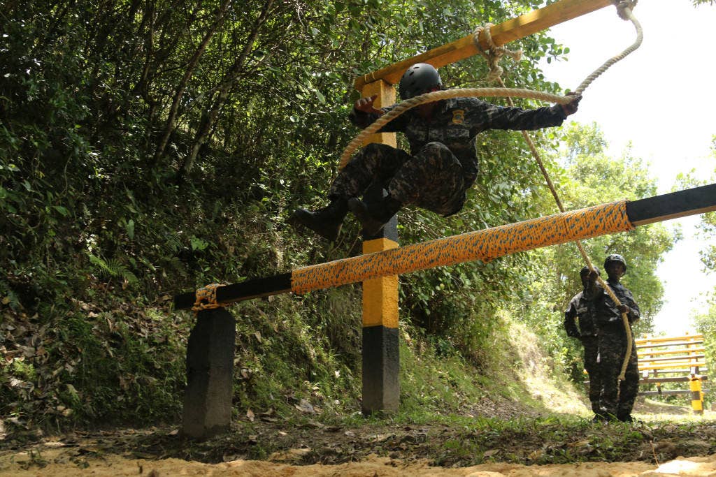 Haitian competitors navigate an obstacle during Fuerzas Comando 15. (U.S. Army photo by Staff Sgt. Chad Menegay)